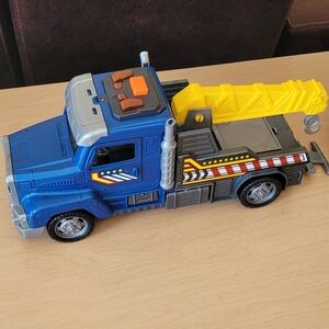 Blue and Yellow Toy Tow Truck